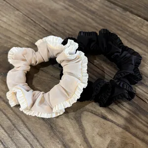 Chic satin hair scrunchies with elegant ruffle edge, soft fabric hair ties for daily styling.