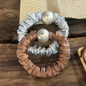 Satin pearl hair scrunchies set featuring elegant large pearls and high elastic design for women.