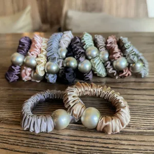 Satin scrunchies with large pearls, elegant sweet hair ties and high elastic hair accessories for women.