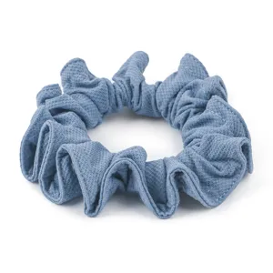 Close-up detail of blue honeycomb ice silk hair scrunchie, showing soft fabric and elastic texture.