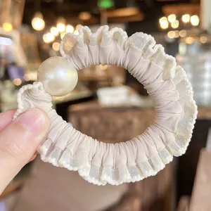 Elegant beige lace hair scrunchie with large artificial pearl chic bun maker fashion accessory