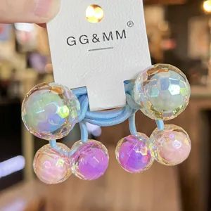 Colorful disco ball hair tie detail, cute children hair accessory with sparkling faceted beads.