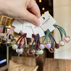 Vue détaillée des élastiques à cheveux transparents cœur double tête, accessoires filles.