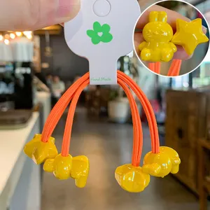 Jolis élastiques à cheveux jaune lapin étoile dessin animé avec cordes orange pour enfants.