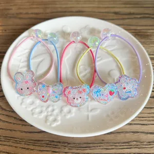 Set di elastici per capelli glitterati con cartoni animati per bambini colorati.