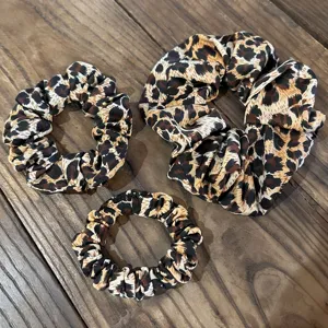 3 pcs leopard print hair scrunchies set. Soft fabric, elastic band for daily hair styling.