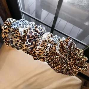 Leopard print satin hair scrunchies set, soft elastic hair ties for women and girls daily styling detail.