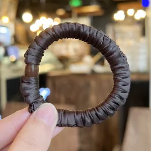 Brown satin hair scrunchie for women, elegant high elasticity hair tie for daily hairstyles.