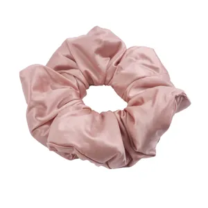Pink satin hair scrunchie for women, soft silk-like voluminous ponytail holder hair accessory.