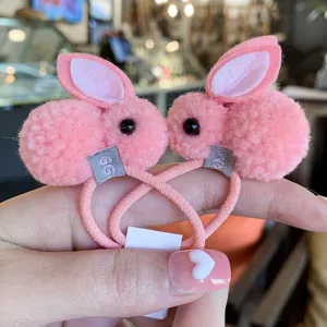 Cute plush bunny hair ties for kids and women, soft pink fuzzy rabbit hair scrunchies.
