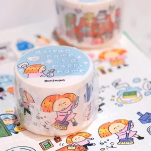 Close-up detail of cute household chores themed washi tape with illustration and clean home slogan.
