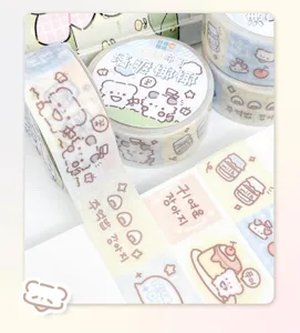 Cute washi tape rolls set with adorable cartoon patterns, perfect for journaling and crafts.