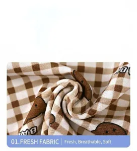 Kids summer pajamas fabric detail, brown plaid with cute bear print, soft and breathable.
