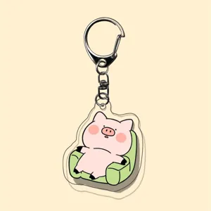Cute acrylic keychain with a lovely cartoon pig sitting on a sofa, perfect backpack pendant.