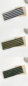 Detailed view of retro striped wide headbands in multiple elastic colors for women's daily use.