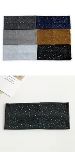 Detail view of the rhinestone embellished stretch headband, showing scattered sparkling studs.