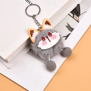 Cute grey plush animal keychain with fluffy pompoms, perfect bag charm and keyring accessory.