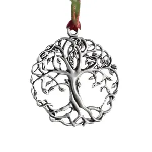 Detailed shot of vintage silver tree of life ornament, perfect for holiday tree hanging.