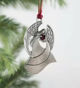 Vintage metal angel Christmas tree hanging ornament with red heart for holiday decor.