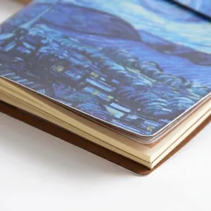 Portable Van Gogh art notebook with faux leather cover and strap closure for daily planning.
