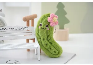 Cute plush cucumber keychain with pink flower, adorable bag pendant and soft toy accessory.