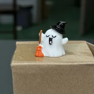 Halloween miniature resin ghost figurine with witch hat and broom, perfect desktop decor.