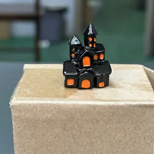 Halloween miniature resin castle figurine, black gothic spooky house ornament for holiday decor.