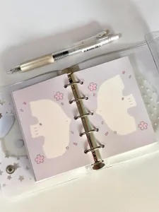 Detailed close-up of cute M5 loose-leaf planner inner pages with sweet bird and cherry blossom.