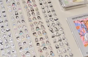 Detailed shot of cute Q-version character illustrated sticker rolls, perfect for journal decorating.