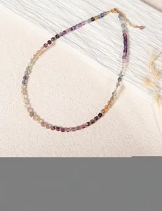 Detailed view of colorful fluorite square beads necklace, elegant gemstone beaded jewelry.