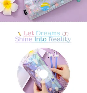 Vista ravvicinata dettagliata della trousse glitterata spaziale con simpatiche penne unicorni.