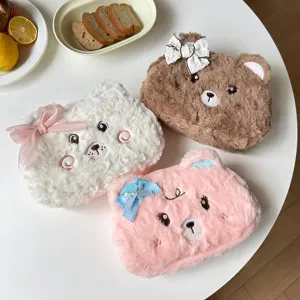 Cute fluffy bear pencil case with bow detail, soft plush stationery storage bag for student daily use.