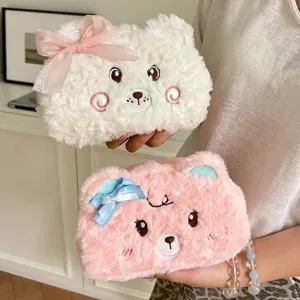 Cute plush bear pencil pouch with bow detail, soft stationery storage bag for students.