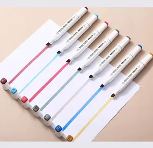 Detailed view of dual-tip alcohol markers with white square barrels and neat color swatches.