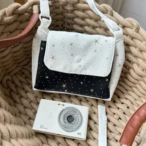 Canvas star pattern crossbody bag with camera prop, stylish daily storage shoulder handbag.