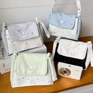 Canvas star pattern crossbody bag with multi-layer storage for daily use and camera carrying.