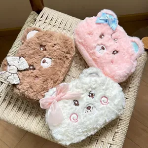 Cute cartoon bear plush pencil case, soft fuzzy stationery storage bag with bow and embroidery.