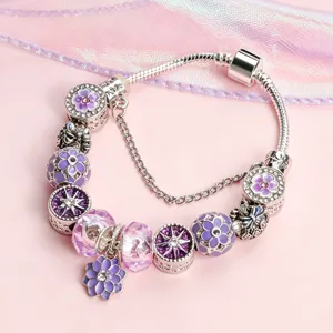 Silver-tone DIY charm bracelet with purple enamel cherry blossom floral beads and safety chain.
