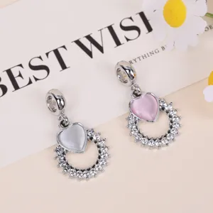Close-up detail of silver heart rhinestone charm pendant for DIY bracelet and necklace.