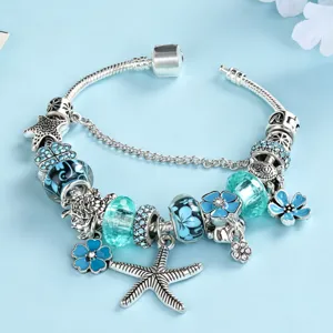Blue ocean style starfish and flower charm bracelet detail showing intricate beadwork.