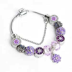 Silver charm bracelet with purple flower beads and safety chain for women fashion jewelry.