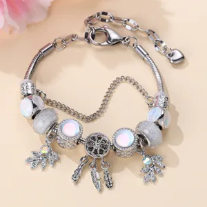 Silver charm bracelet with opal beads, dreamcatcher and leaf dangles, detailed close-up shot.