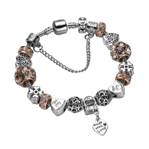Bracelet charms en argent avec perles pavees or rose et pendentifs coeur pour femmes.