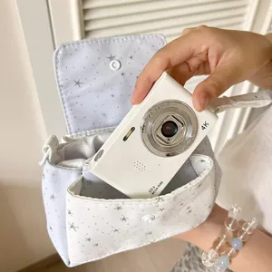 Detailed view of the star pattern multi-layer cosmetic pouch and portable camera storage bag.