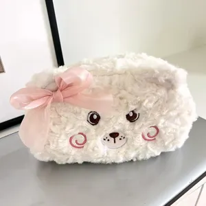 Cute plush bear pencil case detail shot, soft white furry texture with pink bow, close-up.