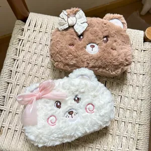 Closeup detail of cute plush bear pencil pouch with bow, soft furry texture and large capacity.