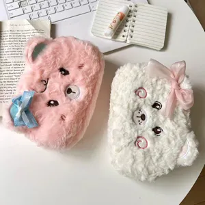 Cute fluffy bear pencil case set on a clean desk, showing soft plush texture and sweet bows.