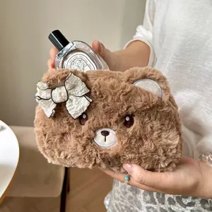 Cute brown plush bear pencil case with soft furry texture, embroidered face and bow detail.