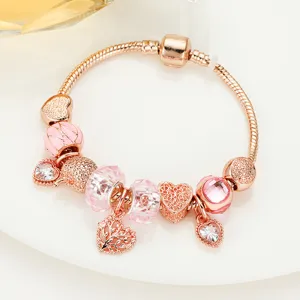 Rose gold DIY charm bracelet for women with pink crystal beads, heart charms and tree of life.