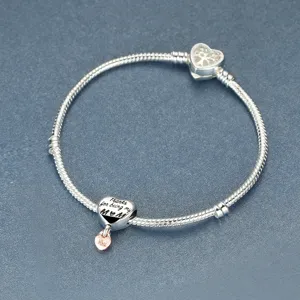 Silver snake chain bracelet with Pandora style charm, heart clasp and mother love bead.